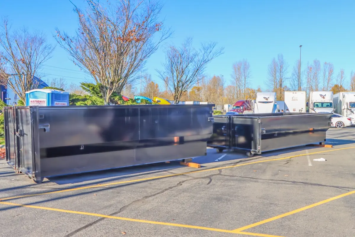 Professional dumpster rental service with roll-off container on residential driveway in Luzerne